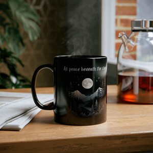 At Peace Beneath the Stars | Black Ceramic Mug | Night Sky and Mountains