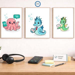 May include: Three framed art prints with cartoon sea creatures. An octopus holds a phone, a seahorse wears a tie with "CSR", and a dragon holds a "help" sign. The prints are above a desk with headphones, a phone, and a coffee cup.