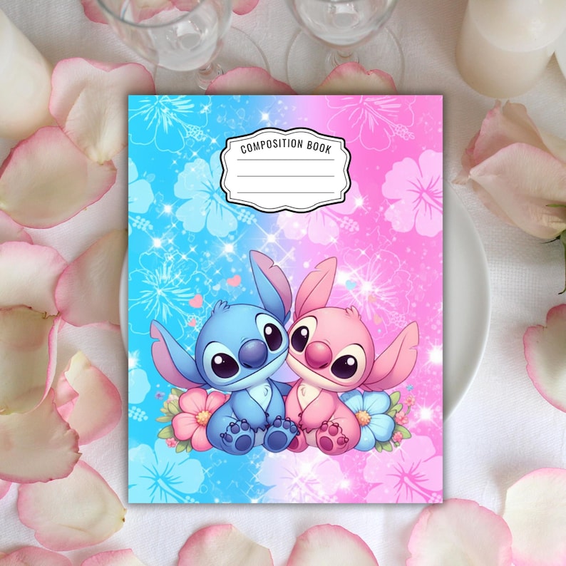 May include: Composition book with a blue and pink split background, featuring a cartoon illustration of two characters. The characters are sitting on flowers. The book has the words "COMPOSITION BOOK" in a white label.