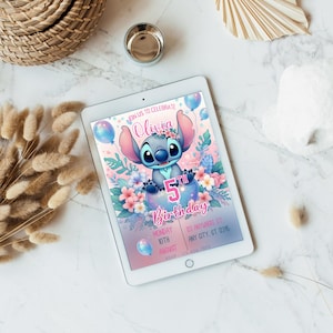 May include: A digital tablet displays a birthday invitation featuring the character Stitch. The invitation has a pink and blue color scheme with floral accents and the text "Olivia 5th Birthday". Additional text includes the date and RSVP information.
