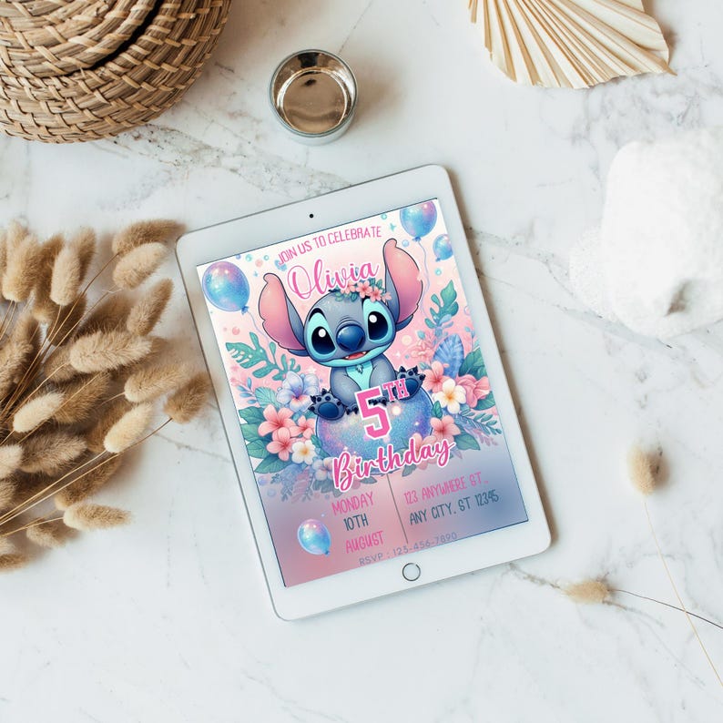 May include: A digital tablet displays a birthday invitation featuring the character Stitch. The invitation has a pink and blue color scheme with floral accents and the text "Olivia 5th Birthday". Additional text includes the date and RSVP information.