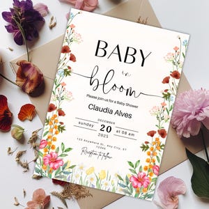 May include: A floral baby shower invitation with the text "BABY in bloom" and the date "DECEMBER 20, 2025 at 08 am".