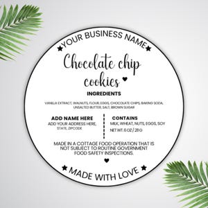 May include: A round, white label with black text, advertising "Chocolate chip cookies." The label includes a list of ingredients and a net weight of 6 oz (211g). The text "Made with Love" is also included.