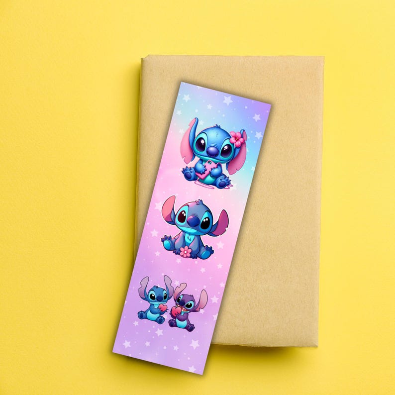 May include: A colorful bookmark featuring three illustrations of the character Stitch from the Disney movie Lilo & Stitch. The bookmark has a gradient background of pink, purple, and blue with white stars. Stitch is blue with pink ears and is holding a flower.