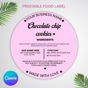 May include: A circular, pink food label with the words "Chocolate chip cookies." The label includes ingredient details, space for a business name and address, and a statement about food safety. The label is 211g.