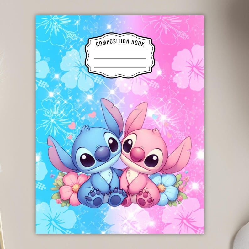 May include: Composition book with a blue and pink background, featuring a cartoon illustration of two characters. The characters are sitting on flowers. The top of the book has the words "COMPOSITION BOOK" in a white box.
