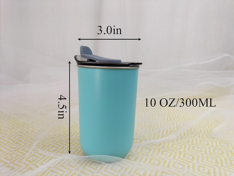 May include: A light blue insulated tumbler with a black lid and a flip-top closure. The tumbler is 4.5 inches tall and 3.0 inches wide, with a capacity of 10 oz. The tumbler is designed to keep beverages hot or cold.