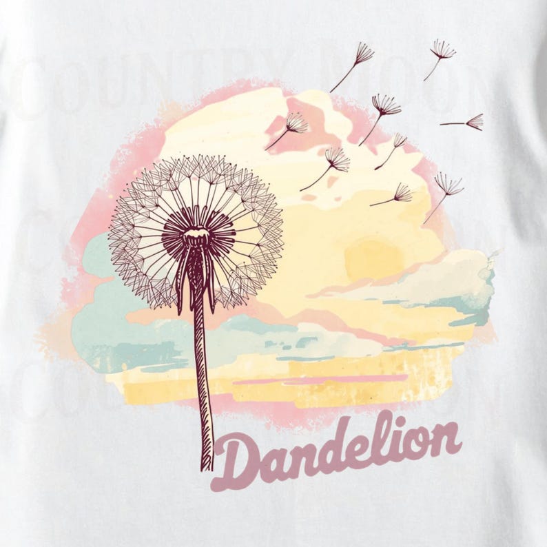 May include: White t-shirt featuring a detailed illustration of a dandelion with seeds blowing in the wind. The design includes a pastel sunset background and the word "Dandelion" in a script font.