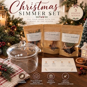 May include: A Christmas Simmer Set featuring three brown paper pouches labeled Evergreen Lodge, Vanilla Snowfall, and Christmas Morning, alongside a clear glass pot with a lid and a white instructional card detailing how to use the botanical kits.