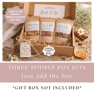 May include: A bridal shower gift box with three simmer pot kits. The kits are in brown pouches with labels. The box includes a tag that says "Bride To Be". The text on the image says "Create the perfect bridal shower gift box".
