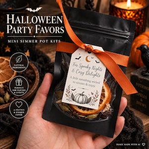 May include: A black pouch containing a mini simmer pot kit, tied with an orange ribbon and a tag reading: Halloween Party Favors, For Spooky Nights & Cozy Delights, A little something wicked to simmer & enjoy, featuring a pumpkin illustration.