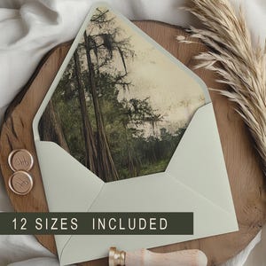May include: A light green envelope with a forest scene inside, resting on a wooden surface. The text "12 SIZES INCLUDED" is displayed on a dark green banner. Gold wax seals and a wooden wax stamp are also present.