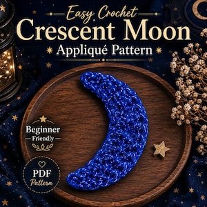 May include: A blue crochet crescent moon appliqué pattern. The text reads Easy Crochet Crescent Moon Appliqué Pattern, Beginner Friendly, and PDF Pattern. The crescent moon is a vibrant blue with a subtle shimmer, displayed on a wooden surface.