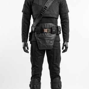 May include: A black tactical costume set featuring a long-sleeved shirt, trousers, a chest plate, a utility belt with pouches, and knee-high boots. The ensemble includes a shoulder strap, structured panels, and reinforced leg guards in a uniform black.