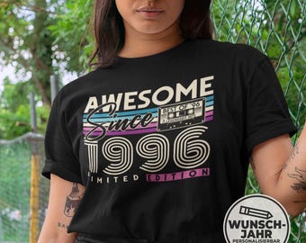 May include: Black t-shirt with the text "AWESOME Since 1996" in a retro design, featuring a cassette tape graphic. The shirt has a vintage aesthetic with a limited edition label.