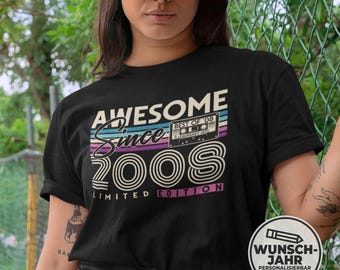 May include: Black t-shirt with the text "AWESOME Since 2008" in a retro design. The design includes a cassette tape graphic and the words "LIMITED EDITION". The shirt is a casual wear item.