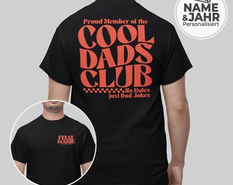 May include: Black t-shirt with the text "Proud Member of the COOL DADS CLUB" in orange. The shirt also features the phrase "No Rules just Dad Jokes." A smaller image shows the text "FELIX MARIE" in orange. A personalized name and year are also shown.