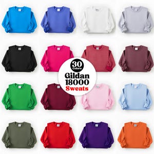 May include: A grid of Gildan 18000 sweatshirts in various colors, including blue, white, black, pink, red, green, and purple. The image features a circular graphic with the text "30 Colors" and "Gildan 18000 Sweats".