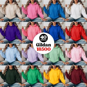 May include: A selection of Gildan 18500 hoodies in various colors, including beige, pink, blue, white, purple, red, light blue, lavender, green, and yellow. The image displays 40 colors of the hooded sweatshirts.