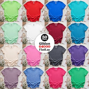 May include: A collection of sixteen Gildan 64000 t-shirts in various solid colors including lime green, red, blue, turquoise, mint, white, maroon, teal, beige, pink, charcoal, purple, lavender, heather blue, magenta, and emerald green.