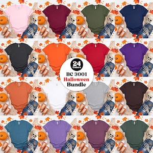 May include: A collection of twenty-four short-sleeved t-shirts in various solid colors, including pink, maroon, olive, navy, black, orange, red, purple, rust, white, gray, brown, teal, and green, displayed with skeleton hands and pumpkins.