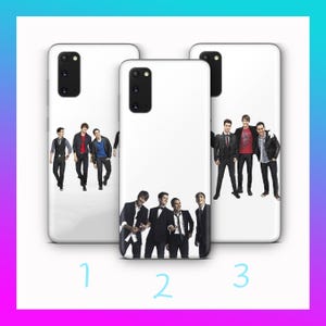 May include: White phone cases with images of a musical group. The cases feature different group photos, with the band members in various outfits. The cases are numbered 1, 2, and 3.