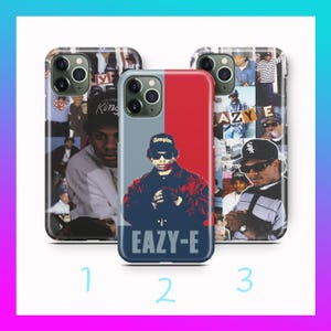 May include: Three phone cases with different designs. One case features a collage of images, another has a red and gray split design with the text "EAZY-E", and the third case has a collage of images with the text "AZY E".
