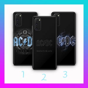 May include: Three black phone cases featuring the AC/DC logo. One case has the text "BLACK IC", another reads "BACK IN BLACK", and the third displays the logo with a lightning bolt design. The cases are displayed against a gradient background.