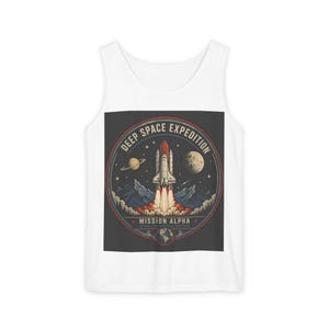 May include: A white tank top featuring a circular graphic on the chest. The design depicts a space shuttle launching into the sky with the text DEEP SPACE EXPEDITION and MISSION ALPHA, surrounded by a planet, the moon, and a small Earth icon.