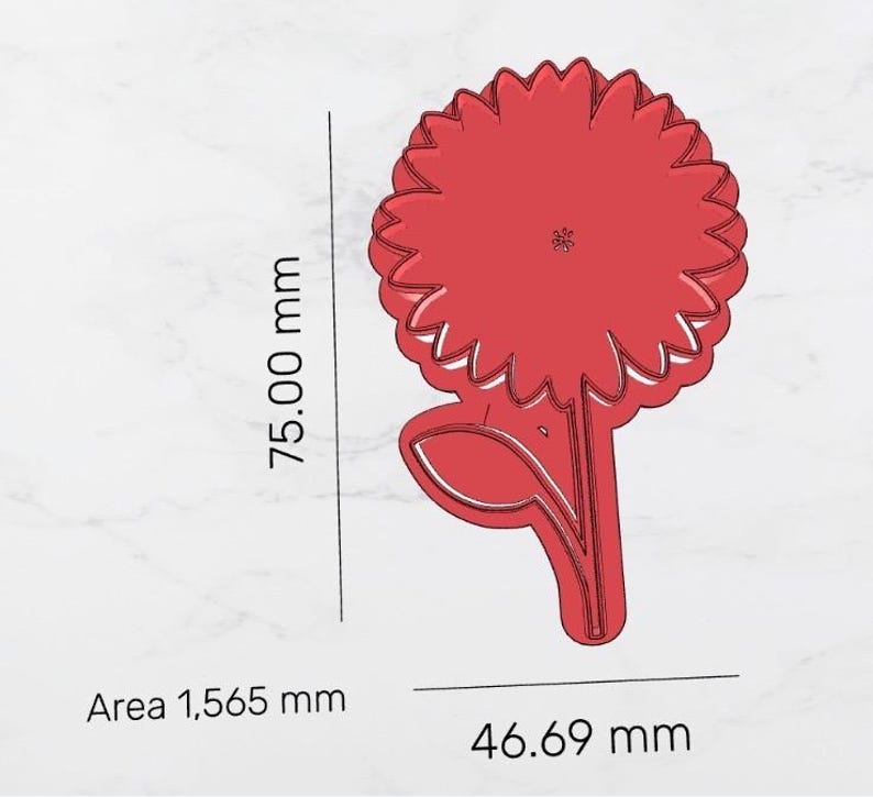 May include: A red sunflower-shaped cookie cutter with a stem and leaf. The cutter is 75 mm tall and 46.69 mm wide. The area is 1,565 mm. The design is a simple outline of a sunflower.