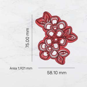 May include: Red and white floral design with leaves. The design measures 75.00 mm in height and 58.10 mm in width. The area is 1,921 mm. The design is likely for crafting or decoration.