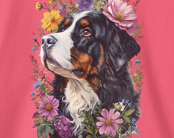 Puede incluir: Un perro de montaña bernés con un pelaje negro, marrón y blanco está rodeado de una corona de flores rosas, moradas y amarillas. El perro está mirando hacia la izquierda de la imagen.