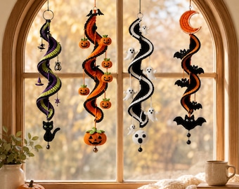 May include: Four hanging spiral decorations for Halloween. The first is purple and green with a black cat. The second is orange and black with small pumpkins and a large pumpkin base. The third is black and white with ghosts. The fourth is orange and black with bats and a crescent moon.