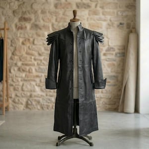 May include: A set of three ceramic vases in varying heights and shapes. The vases are glazed in a matte white finish, offering a minimalist aesthetic. The tallest vase is approximately 25 cm high.