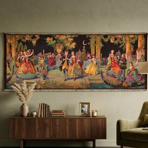 May include: A large tapestry depicting a nighttime scene with figures in historical attire. The artwork features a dark background with a crescent moon, trees, and buildings. The figures are dressed in colorful gowns and suits, suggesting a ball or gathering.