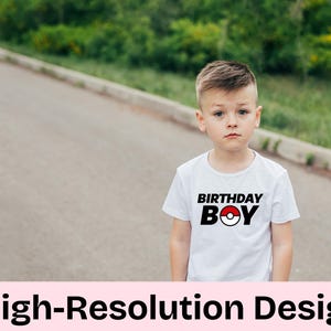 May include: A white t-shirt with a black and red graphic that says "Birthday Boy" and features a red and white Pokeball.