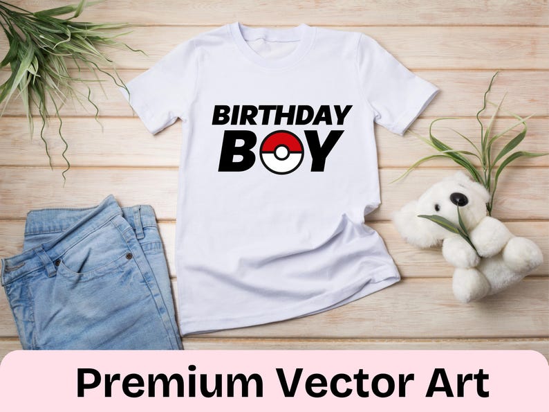 May include: White t-shirt with black text that says "Birthday Boy" and a red and white Pokeball graphic.