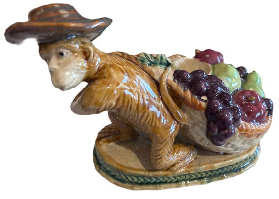 ceramic monkey with fruit