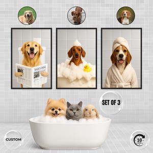 May include: Set of three framed wall art prints featuring dogs in humorous bathroom scenes. One print shows a Golden Retriever reading a newspaper, another a Dachshund in a bubble bath, and a third a Beagle in a bathrobe.