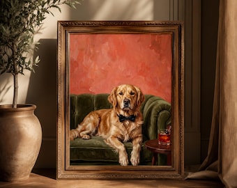 May include: A framed portrait featuring a golden retriever wearing a black bow tie, lying on a dark green velvet sofa against a textured coral-colored wall. A small glass containing a reddish beverage sits on a round wooden side table nearby.