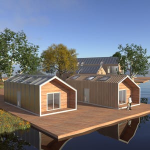 Puede incluir: Dos pequeñas casas de madera modernas con techos de metal se encuentran sobre una plataforma de madera sobre un cuerpo de agua. Las casas tienen grandes ventanas y un exterior de madera clara.