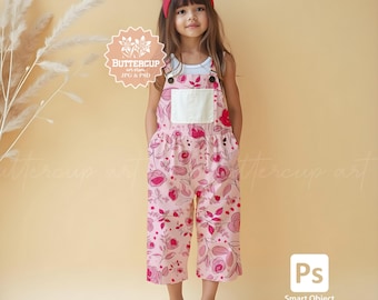May include: A young child wearing a pink floral jumpsuit with a white pocket and white sneakers. The jumpsuit has a rose pattern and is paired with a red headband. The image includes the text "Buttercup art" and "JPG & PSD".