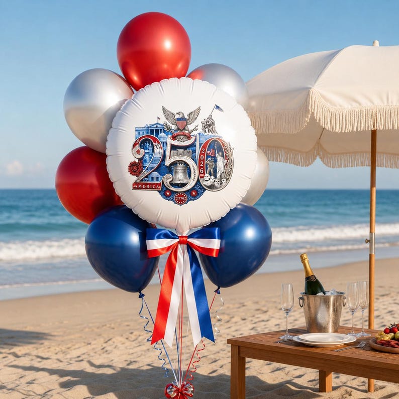 May include: A festive balloon bouquet with red, silver, and blue balloons. A large, round balloon in the center displays the text "250 AMERICA" with patriotic imagery. The bouquet is tied with red, white, and blue ribbons, perfect for a celebration.