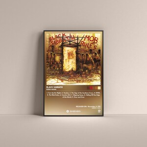 May include: Framed poster featuring the album art for Black Sabbath's "Born Again." The artwork depicts a dark, surreal scene with figures and a central door. The poster includes the album title, tracklist, and release date.