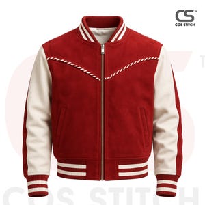 May include: A red and cream-colored varsity jacket with a zip-up front. The jacket features cream-colored sleeves, a red body, and white striped detailing on the collar, cuffs, and hem. The jacket has a decorative white rope design across the chest.