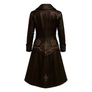 May include: A brown leather coat with a long, flared skirt. The coat features a notched collar and decorative stitching of ship wheels and flourishes. The cuffs and back panel have detailed embroidery. The coat is a medium length.