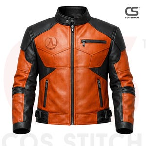 May include: A two-tone orange and black leather jacket with a stand-up collar and a front zip. The jacket features a circular emblem on the chest and multiple zipped pockets. The sleeves have black accents and buckle details at the waist. The brand name "COS STITCH" is visible.