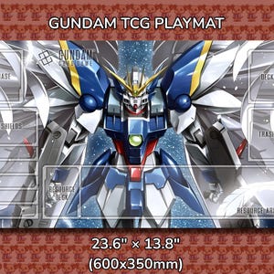 May include: Gundam TCG playmat featuring a detailed illustration of a Gundam robot in blue, white, and yellow. The playmat has designated areas for gameplay, including "Base," "Shields," and "Resource Deck." It measures 23.6" x 13.8".