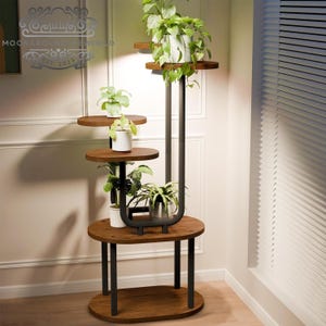 May include: A tiered plant stand with a black metal frame and brown wooden shelves. The stand has four shelves in total, with three oval-shaped shelves and one rectangular shelf at the bottom. The stand is decorated with various potted plants.