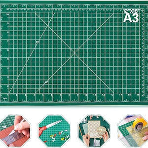 May include: A green cutting mat with white grid lines, angle markings, and inch measurements. The mat is labeled "12"x18" A3". Ideal for crafting and measuring, it provides a clear surface for precise cuts.